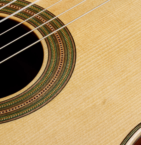 The soundboard and rosette of a 2026 German Vazquez Rubio "Hauser" classical guitar made of spruce and palo escrito