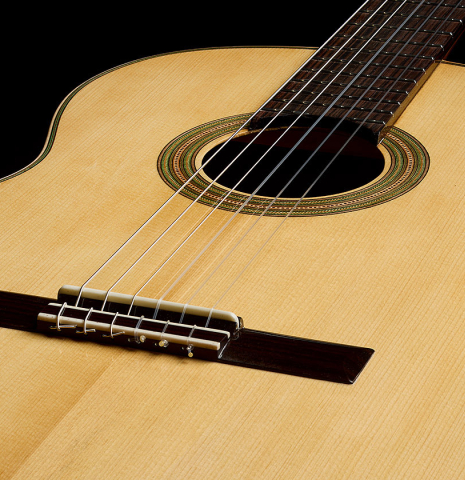 View of the top from the bridge of a 2026 German Vazquez Rubio "Hauser" classical guitar made of spruce and palo escrito