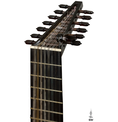 The headstock and tuning pegs of a 1981 David Rubio 9-course lute made of spruce and maple