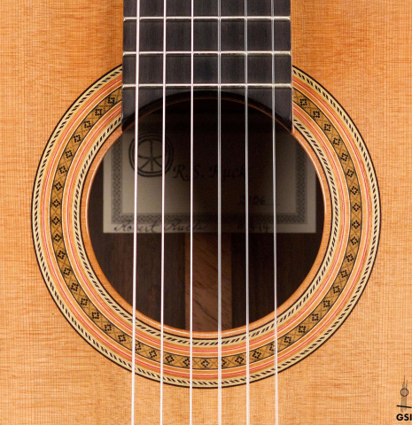 The rosette of a 2006 Robert Ruck classical guitar made of cedar and Indian rosewood