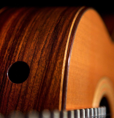 The soundport on the side of a 2006 Robert Ruck classical guitar made of cedar and Indian rosewood