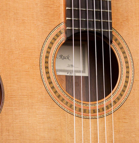 The soundboard of a 2006 Robert Ruck classical guitar made of cedar and Indian rosewood