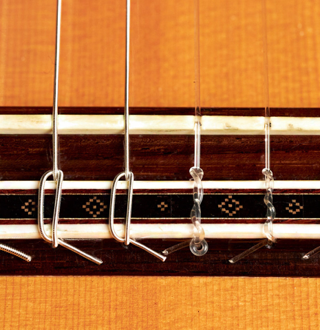 The bridge of a 1978 Robert Ruck classical guitar made with spruce and CSA rosewood.