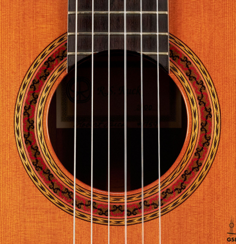 The rosette of a 2000 Robert Ruck classical guitar made with cedar and Indian rosewood