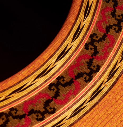 Detail of the rosette of a 2000 Robert Ruck classical guitar made with cedar and Indian rosewood