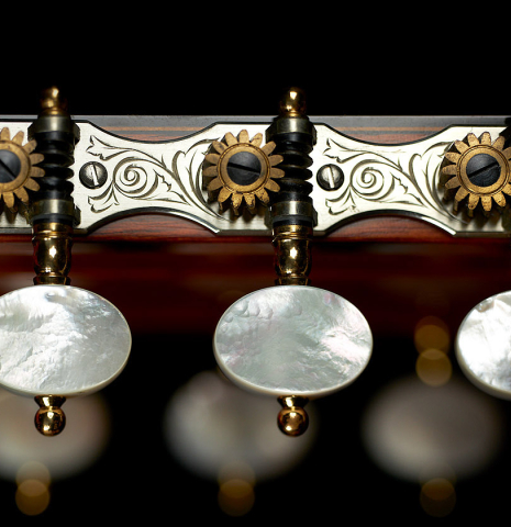The Rodgers tuners on a 2000 Robert Ruck classical guitar made of spruce and Indian rosewood