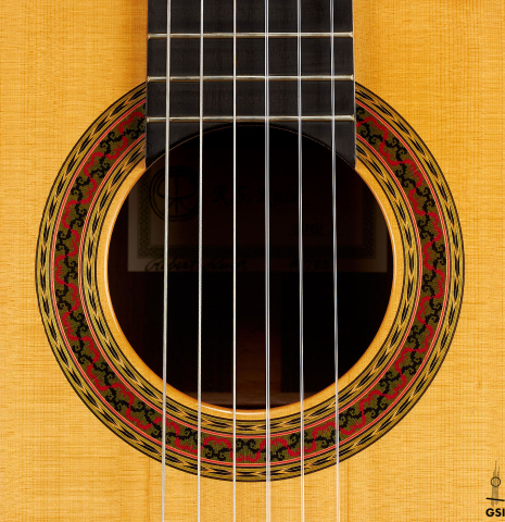 The rosette of a 2000 Robert Ruck classical guitar made of spruce and Indian rosewood