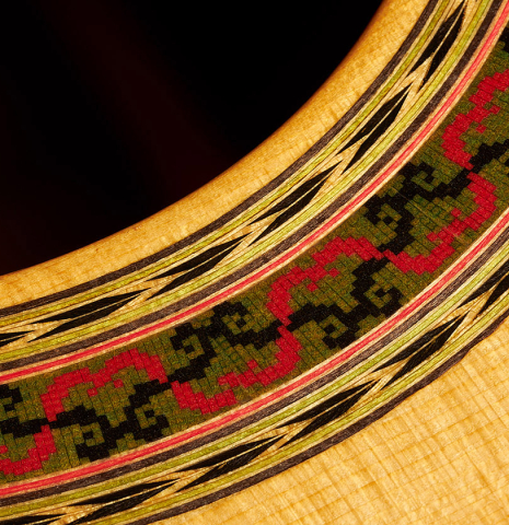 Closeup of the rosette of a 2000 Robert Ruck classical guitar made of spruce and Indian rosewood