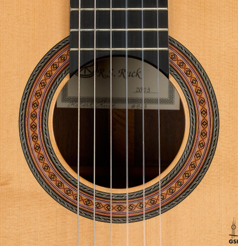 The rosette of a 2003 Robert Ruck classical guitar made of spruce and Indian rosewood