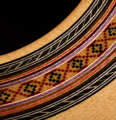 The soundboard and rosette detail of a 2003 Robert Ruck classical guitar made of spruce and Indian rosewood