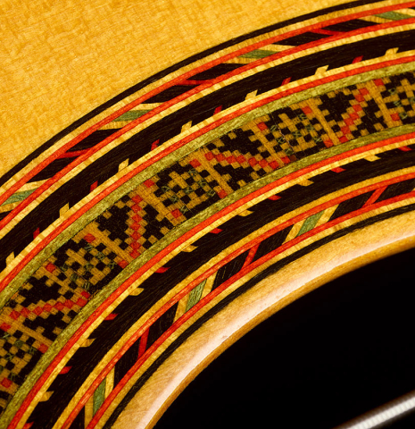 Closeup detail of the rosette of a 1979 Robert Ruck classical guitar made of spruce and CSA rosewood