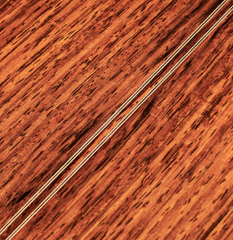 The back of a 1994 Eric Sahlin classical guitar made of cedar and Indian rosewood.