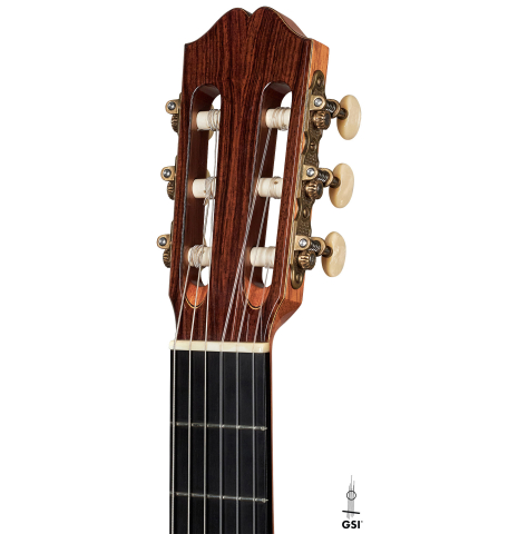 The headstock of a 1994 Eric Sahlin classical guitar made of cedar and Indian rosewood.