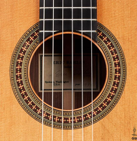The rosette of a 1994 Eric Sahlin classical guitar made of cedar and Indian rosewood.