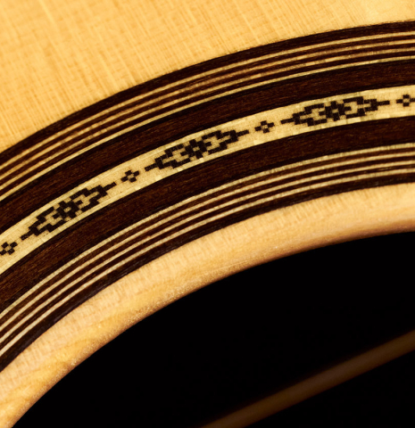 Detail of the rosette of a 2023 Masaki Sakurai "PC" classical guitar made with spruce and CSA rosewood.