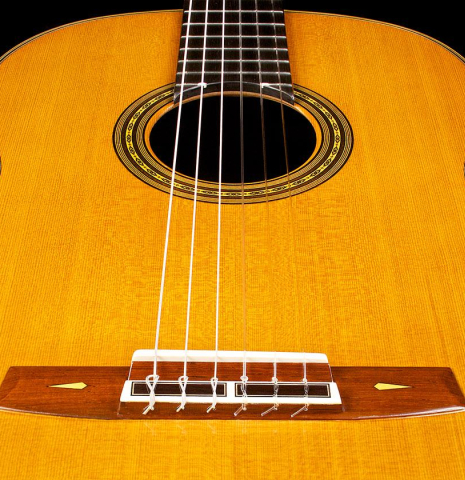 View of the top from the bridge of a 2015 Masaki Sakurai "PC" classical guitar made of cedar and CSA rosewood