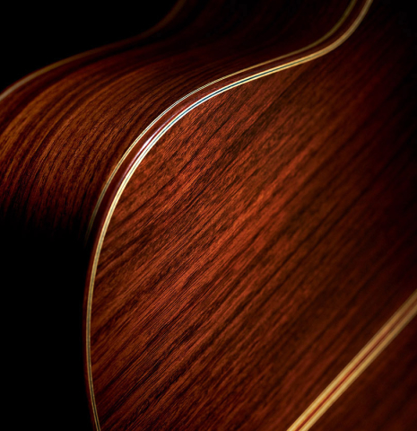 The back and sides of a 2023 Masaki Sakurai "Concert-R" classical guitar made with spruce and Indian rosewood.