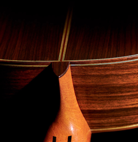 The heel of a 2023 Masaki Sakurai "Concert-R" classical guitar made with spruce and Indian rosewood.