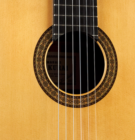 The soundboard and rosette of a 2023 Masaki Sakurai "Special" classical guitar made with spruce and CSA rosewood.
