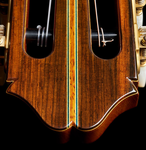 The headstock veneer and purfling of a 2024 Masaki Sakurai "Special" classical guitar made with spruce and African rosewood.