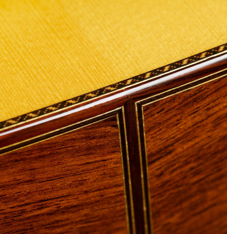 The sides at the foot with top purflings of a 2024 Masaki Sakurai "Special" classical guitar made with spruce and African rosewood.