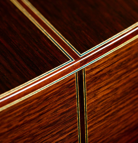 The back and sides at the foot of a 2025 Masaki Sakurai "Concert-R" classical guitar made of cedar and Indian rosewood