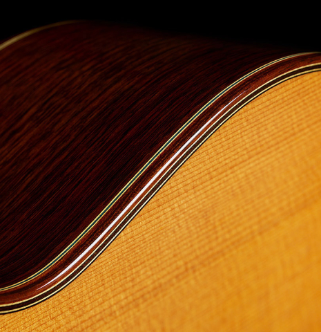 The top binding and purfling of a 2025 Masaki Sakurai "Concert-R" classical guitar made of cedar and Indian rosewood