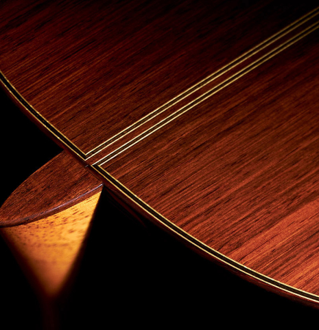 Closeup of the heel and back of a 2023 Masaki Sakurai "Special 640" classical guitar made of spruce and CSA rosewood.