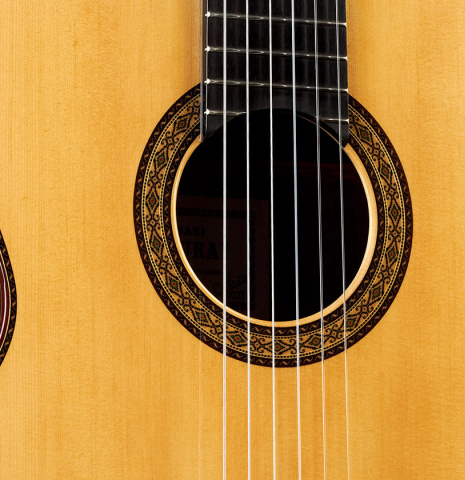 The top and rosette of a 2023 Masaki Sakurai "Special 640" classical guitar made of spruce and CSA rosewood.