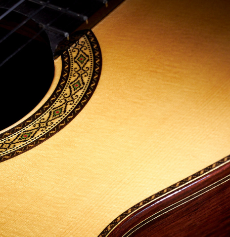 Close-up of the soundboard and rosette of a 2023 Masaki Sakurai "Special 640" classical guitar made of spruce and CSA rosewood.