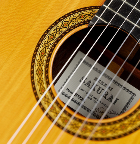Closeup detail of the rosette of a 2024 Masaki Sakurai "Special 640" classical guitar made of cedar and African rosewood
