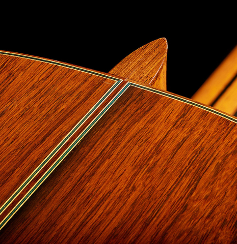 The heel, back binding and purfling of a 2017 Masaki Sakurai "Maestro RF" classical guitar made of spruce and African rosewood