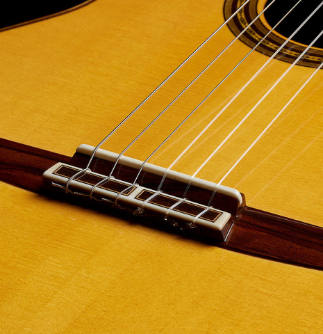 The top, bridge, tie-block and saddle of a 2017 Masaki Sakurai "Maestro RF" classical guitar made of spruce and African rosewood
