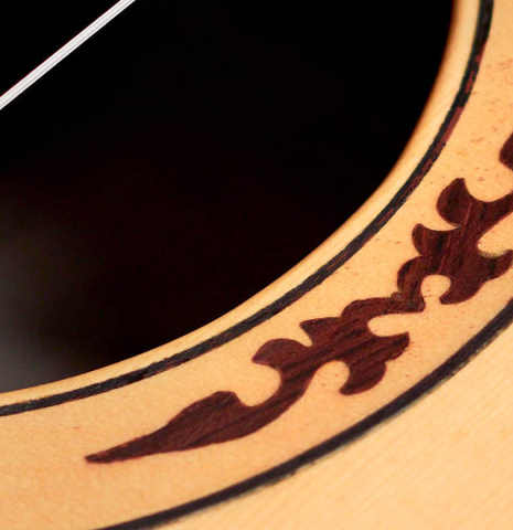 A close-up of the rosette of a 2012 Arturo Sanzano &quot;Concierto&quot; classical guitar made with spruce and Indian rosewood
