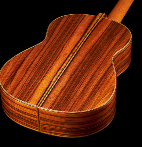 The back and sides at the foot of a 2022 Adrien Savary Freestone "Garcia" classical guitar made of spruce and CSA rosewood