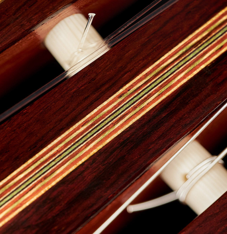 The headstock inlay of a 2008 David Schramm "Hauser" made with spruce and Indian rosewood.