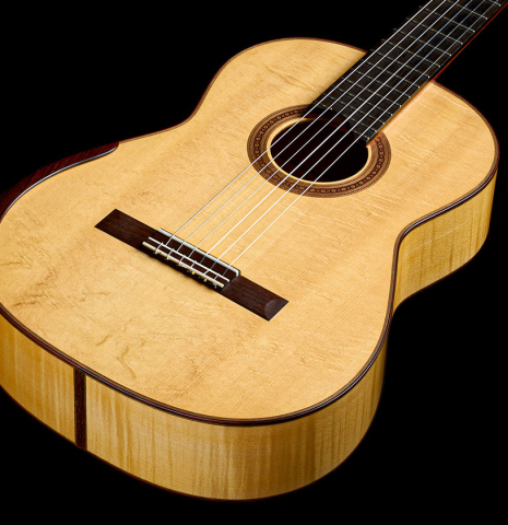 The top and sides of a 2022 Douglass Scott "635" classical guitar made of spruce and maple