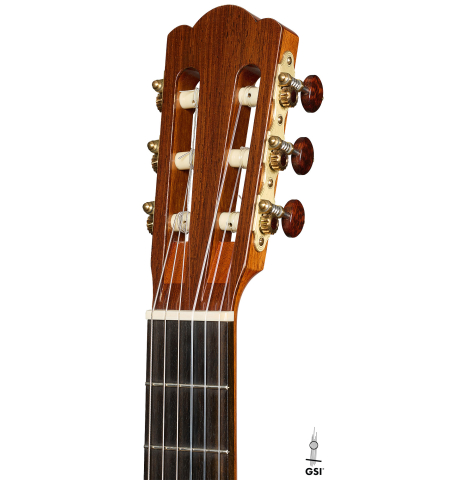 The headstock of a 2022 Douglass Scott "635" classical guitar made of spruce and maple