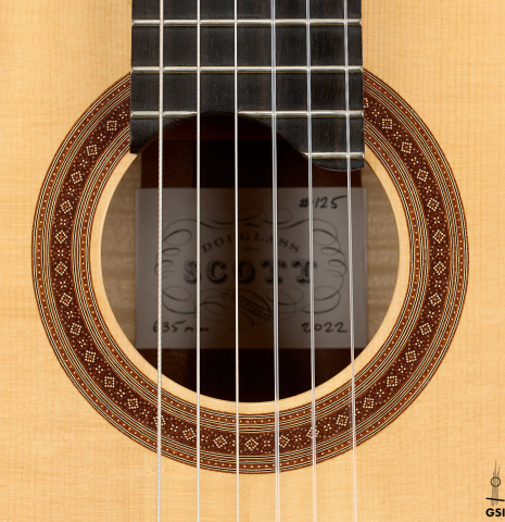 The rosette of a 2022 Douglass Scott "635" classical guitar made of spruce and maple