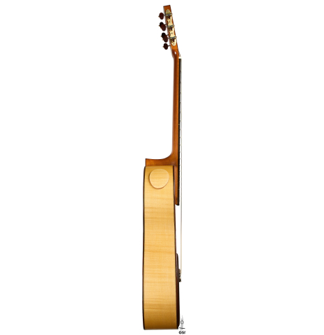 The side of a 2022 Douglass Scott "635" classical guitar made of spruce and maple