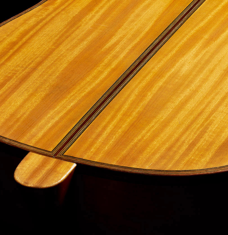 The heel, back binding and purflinbg of a 1929 Francisco Simplicio classical guitar made of spruce and satinwood