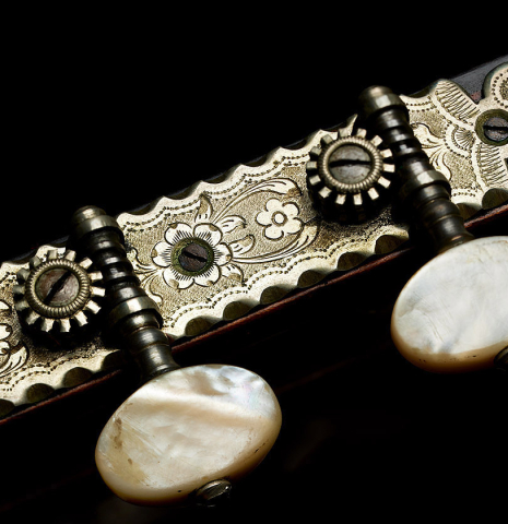 The tuning machines of a 1929 Francisco Simplicio classical guitar made of spruce and satinwood