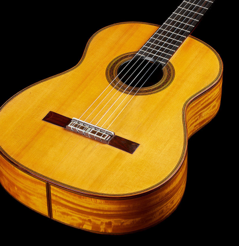 The soundboard of a 1929 Francisco Simplicio classical guitar made of spruce and satinwood