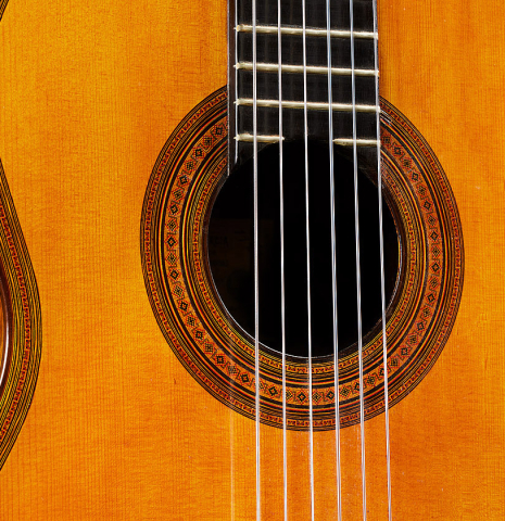 The soundboard and rosette of a 1923 Francisco Simplicio classical guitar made of spruce and CSA rosewood