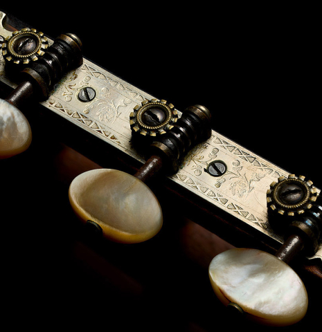 The tuning machines of a 1926 Francisco Simplicio classical guitar made of spruce and CSA rosewood