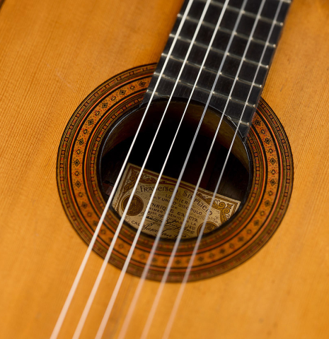 The soundboard, rosette and tornavoz of a 1926 Francisco Simplicio classical guitar made of spruce and CSA rosewood