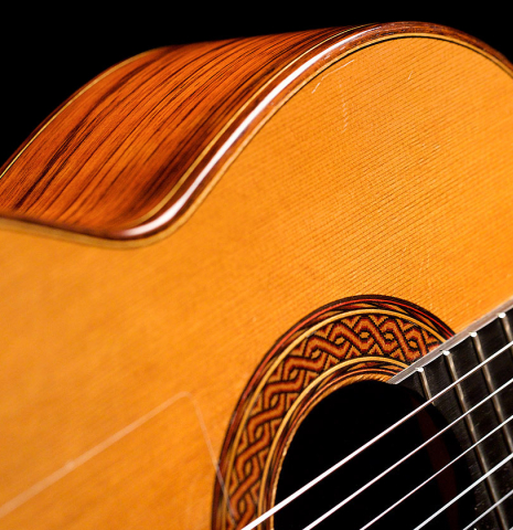 The rosette and side of a 1999 Greg Smallman classical guitar made of cedar and CSA rosewood