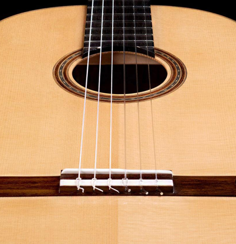The front of a 2019 Youri Soroka "Torres" classical guitar made with spruce and maple.