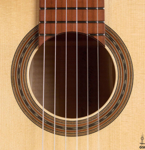 The rosette of a 2020 Youri Soroka classical guitar made with spruce top and maple back and sides.