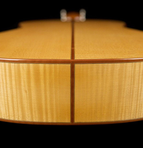 The side of a 2020 Youri Soroka classical guitar made with spruce top and maple back and sides.